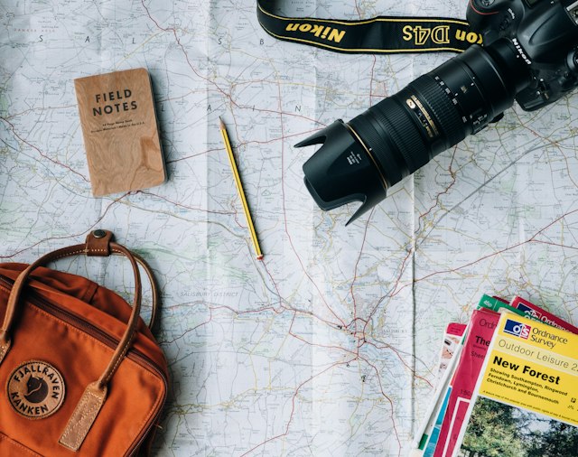 Travel planning materials arranged before a trip