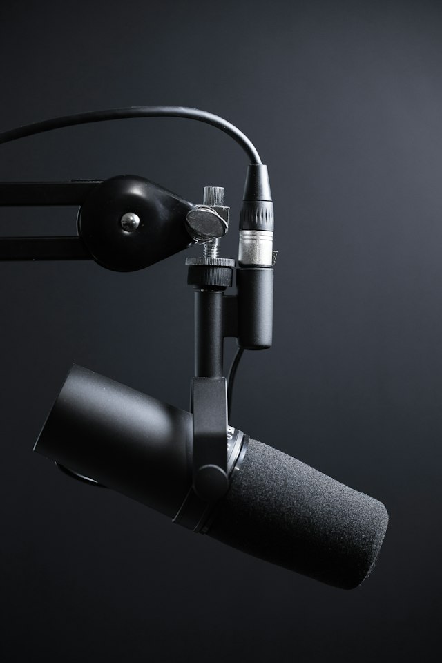 Microphone mounted near a desk for recording and conversation