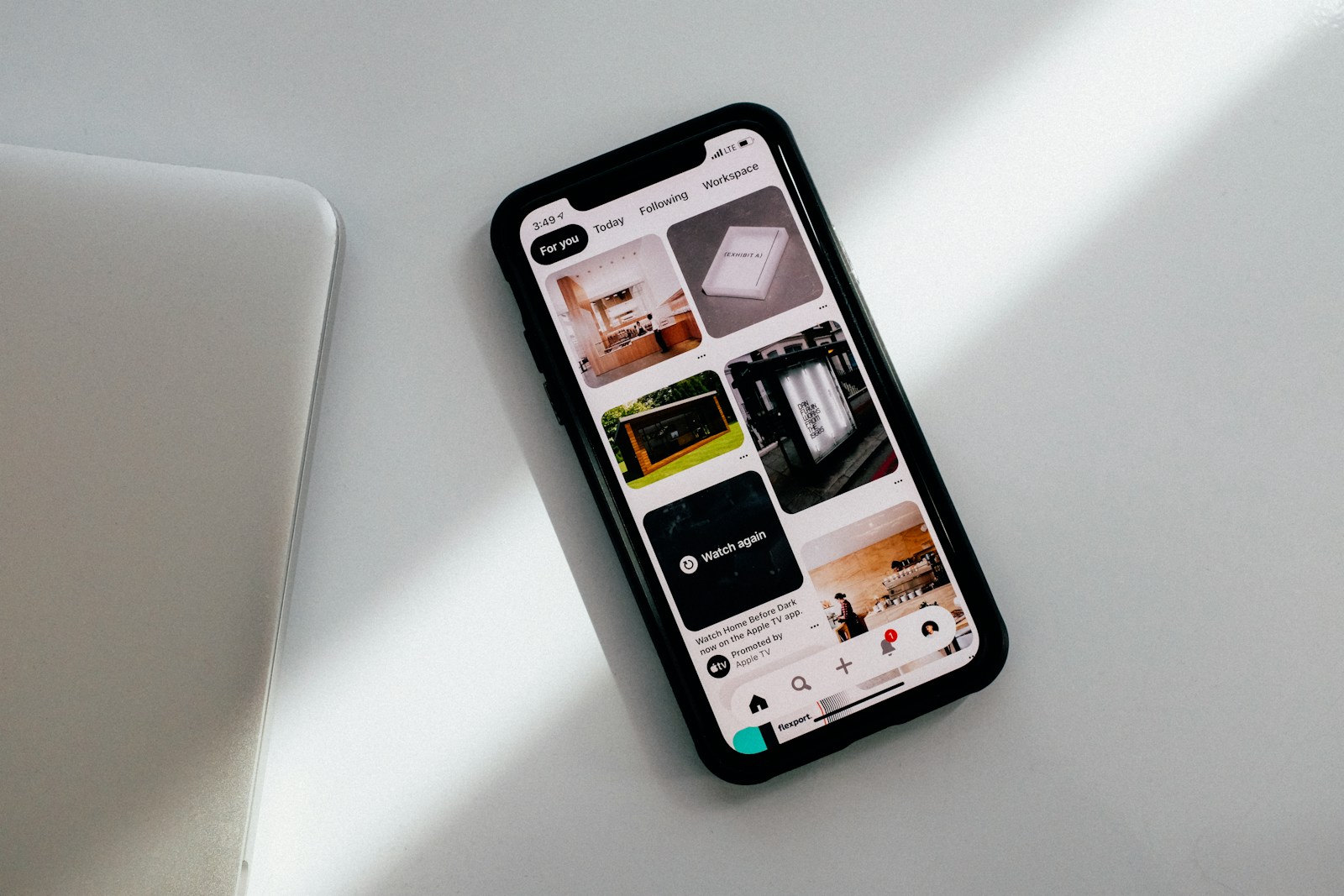 Phone and everyday charging accessories on a surface