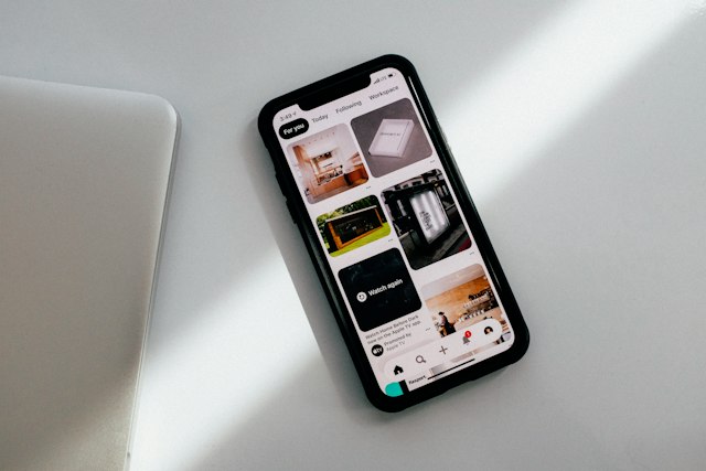 Phone and everyday charging accessories on a surface
